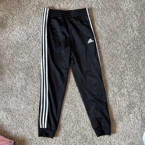 Adidas Black Sweatpants with Iconic Stripes and Tapered Fit